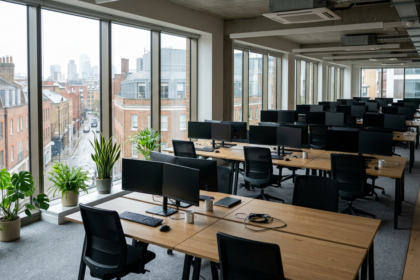 Empty open-plan office with tucked-in chairs, illustrating the four-day working week debate in the UK