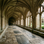 Empty Gothic abbey cloister with worn memorial stones, illustrating the Westminster Abbey sarcophagus study